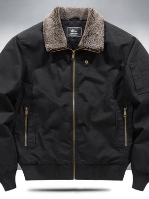 Black bomber jacket with sherpa collar, zip front, and zippered pockets.