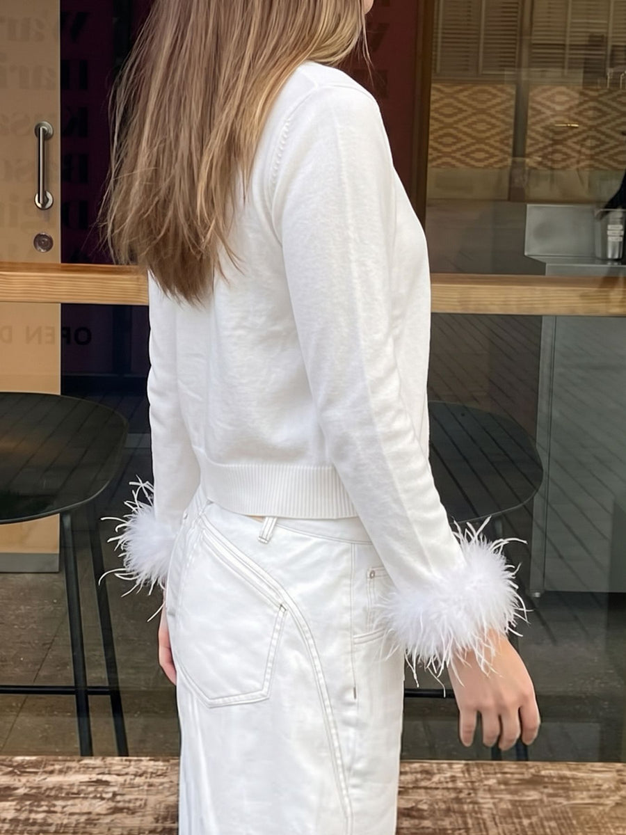 white cardigan with buttoned and long sleeve