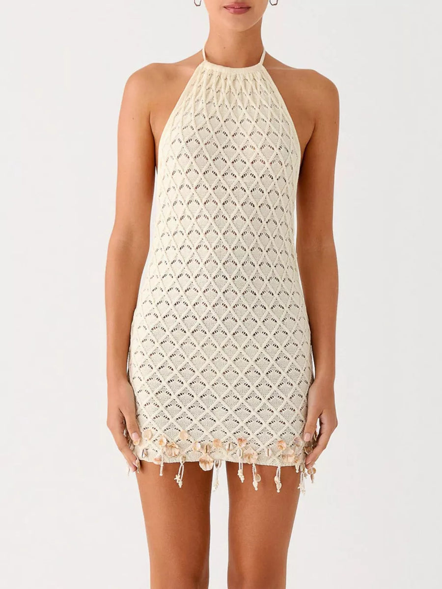 Cream crochet halter mini dress with shell embellishments and fringe hem