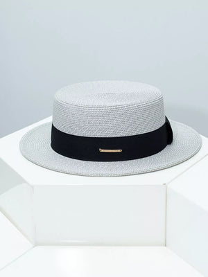 Gray straw boater hat with black ribbon and gold accent detail