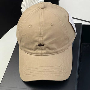 Khaki cotton baseball cap with embroidered detail and ventilation eyelets.