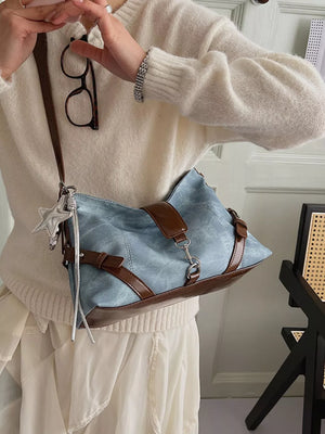 crossbody bag in light blue featuring leather accents and relaxed fit