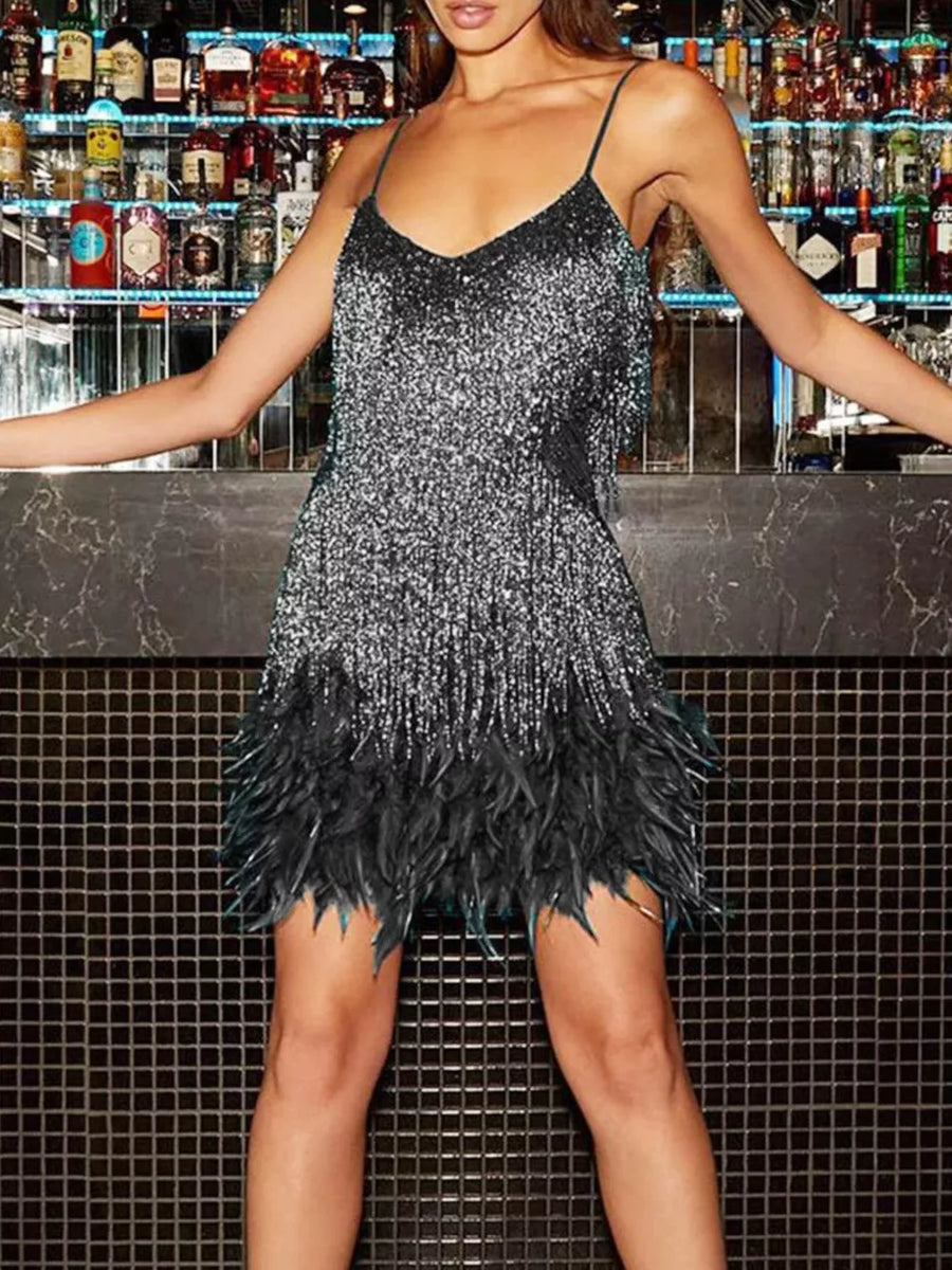 Sparkly silver sequin mini dress with black feather trim and spaghetti straps