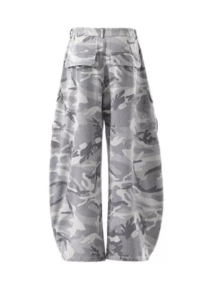 Baggy camo cargo pants in white camouflage with multiple pockets and button fly.