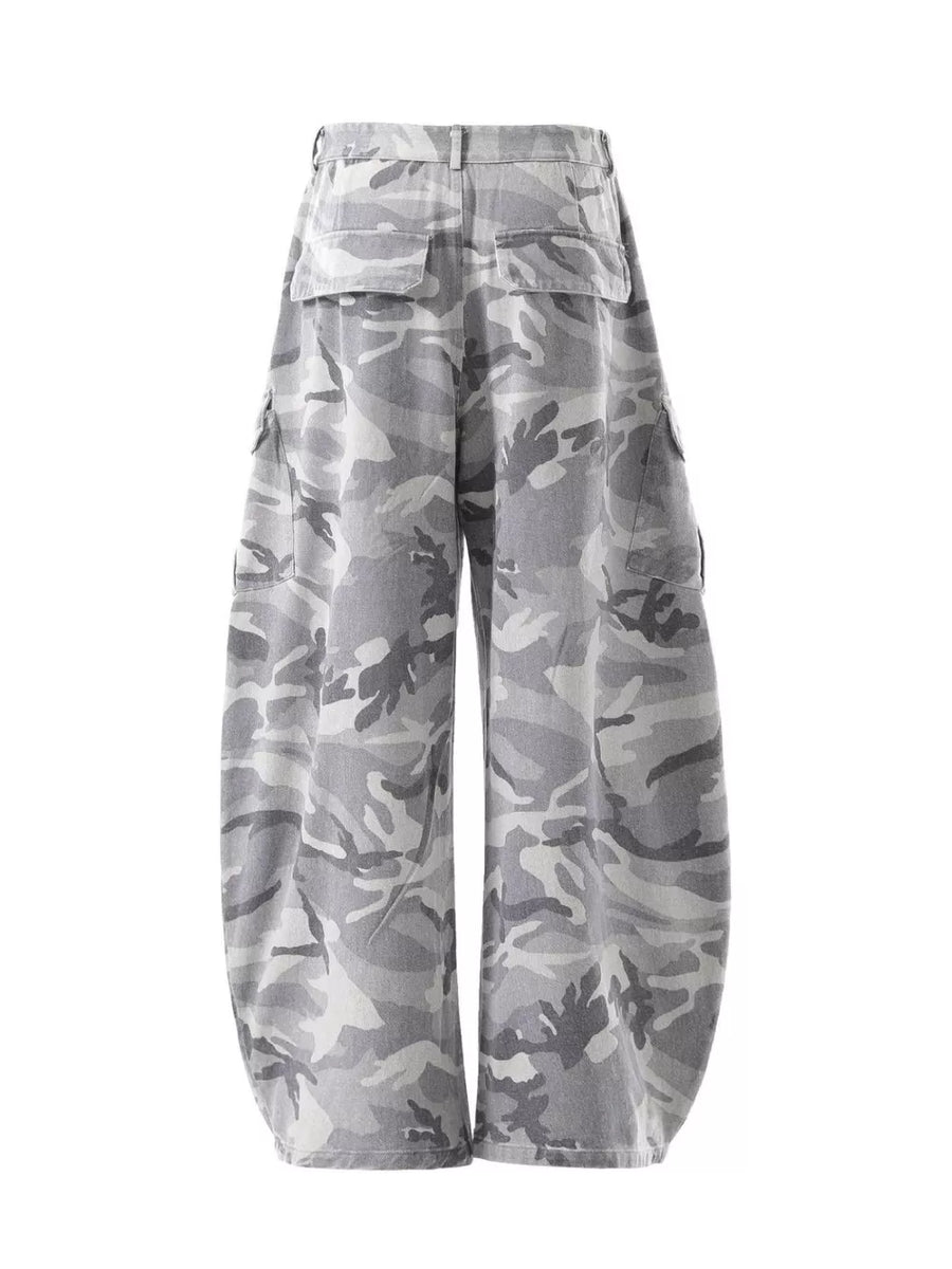 Baggy camo cargo pants in white camouflage with multiple pockets and button fly.