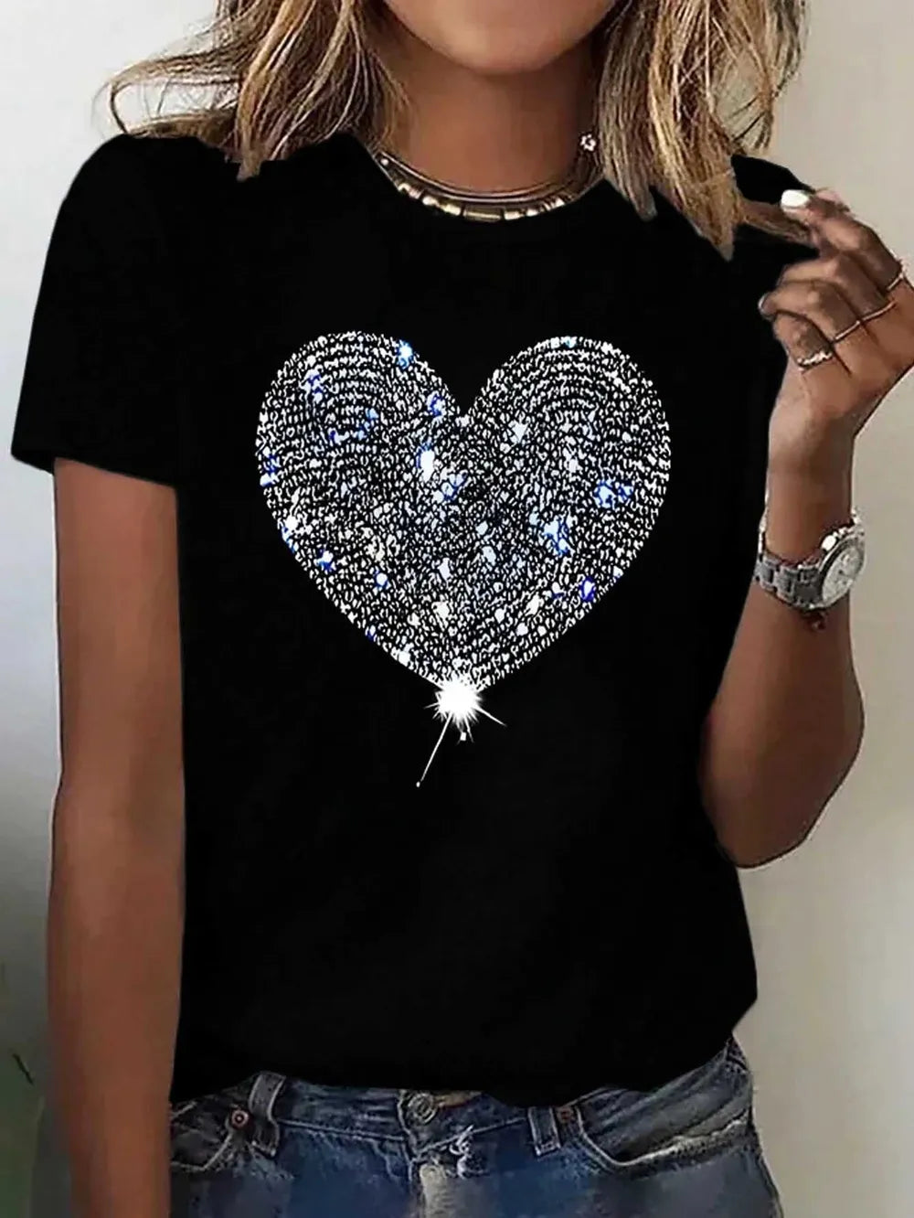 Black t-shirt with a large sparkly heart graphic on the front.