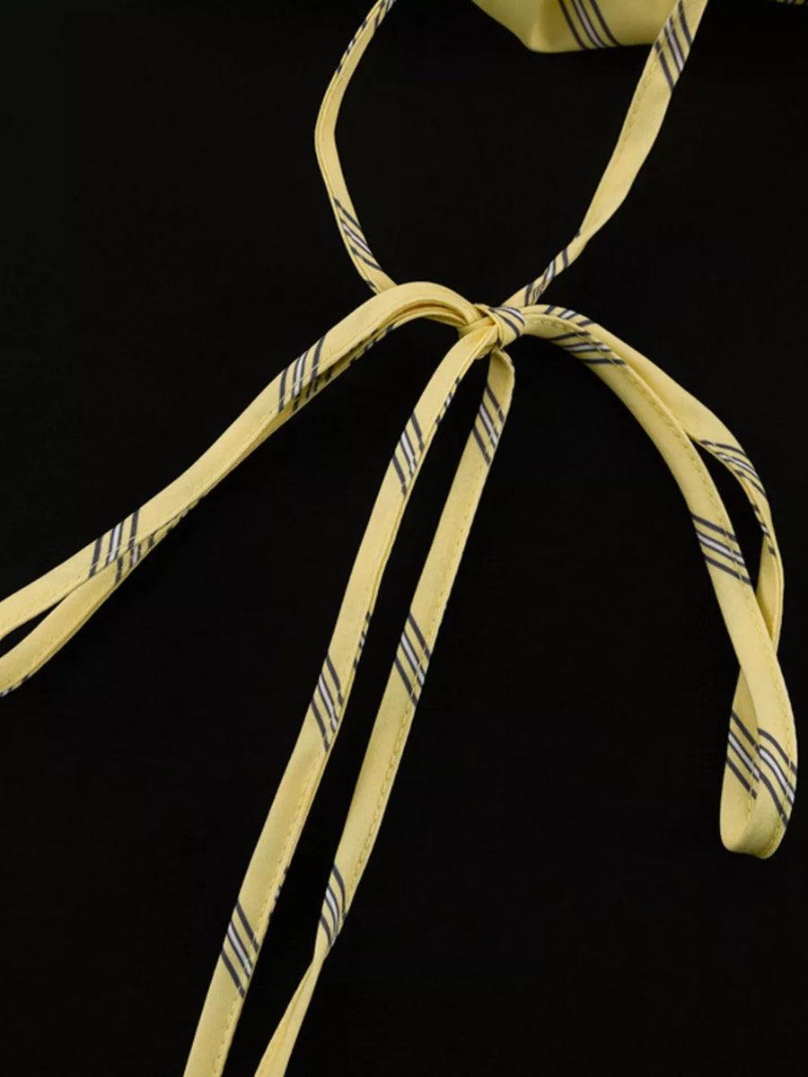 Yellow striped tie-back halter top with thin straps.