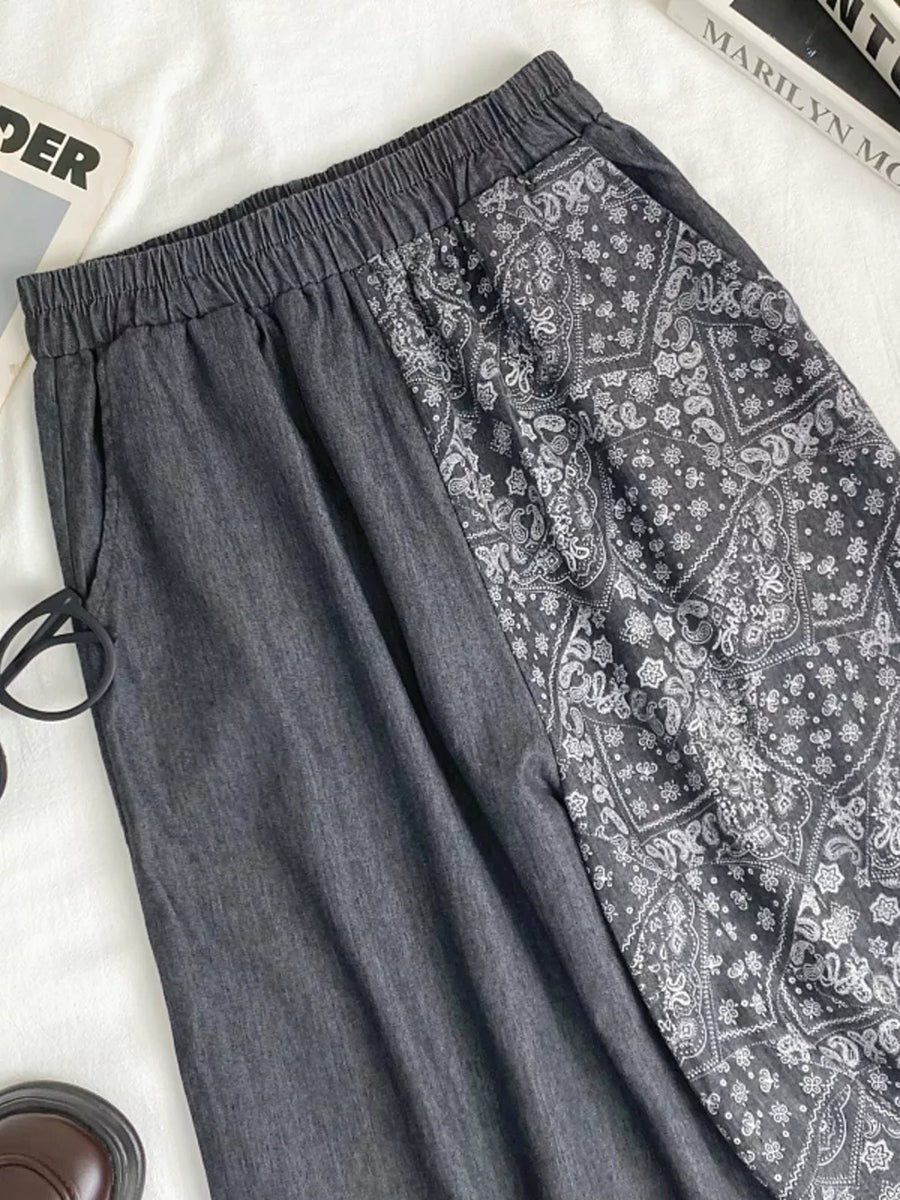 Black comfort jeans with drawstring waist and paisley print panel