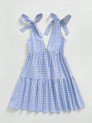 Blue gingham maternity mini dress with tie shoulders and ruffle hem