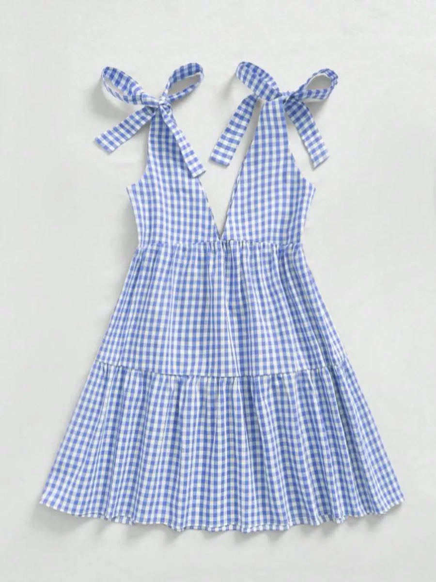 Blue gingham maternity mini dress with tie shoulders and ruffle hem