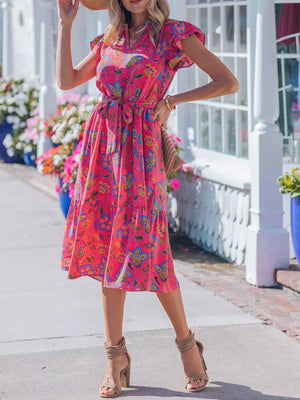 Floral midi dress with ruffled sleeves, V-neck, and tie belt in a cotton blend.