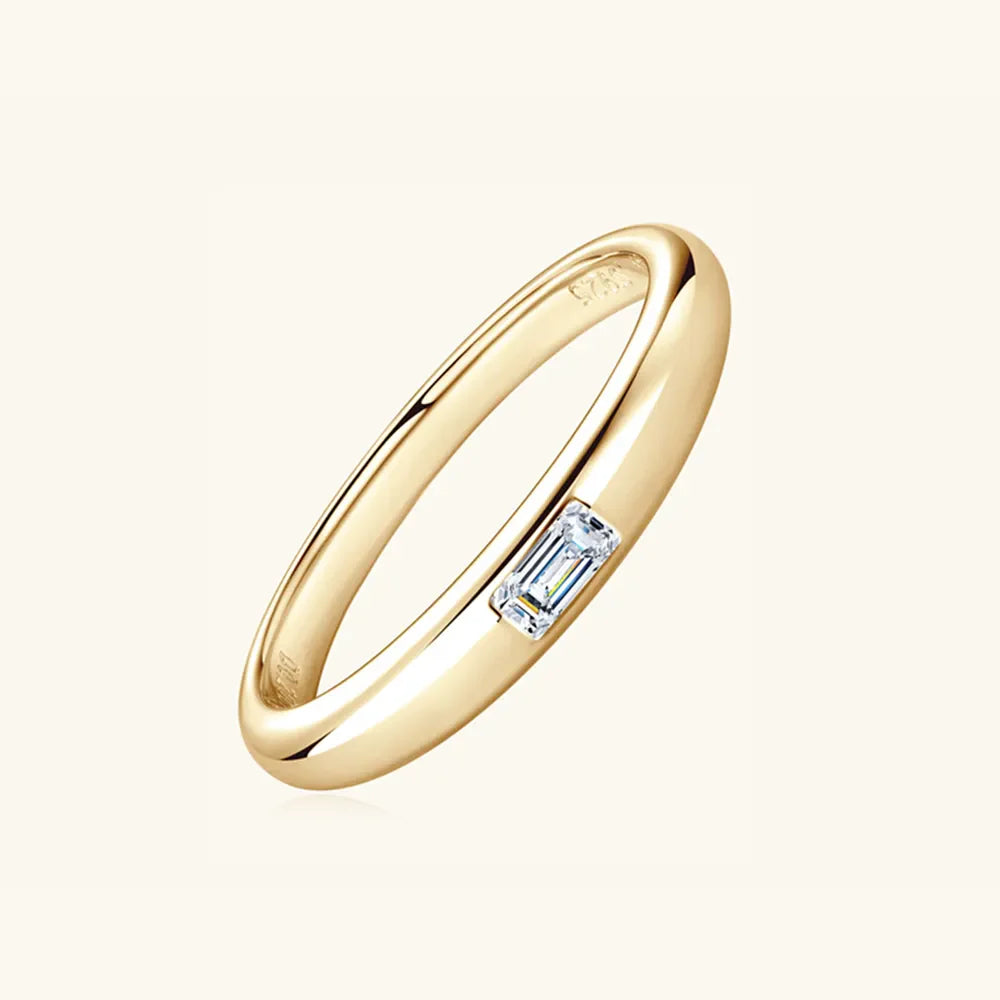 Gold band ring with a single rectangular moissanite stone