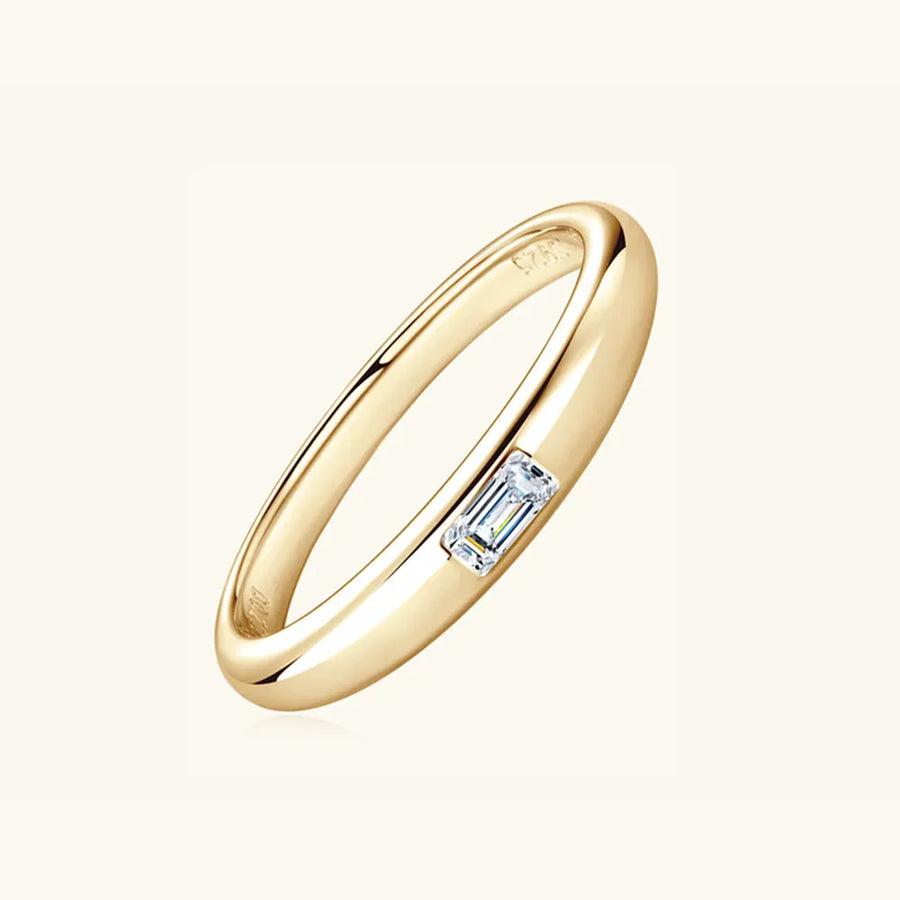 Gold band ring with a single rectangular moissanite stone