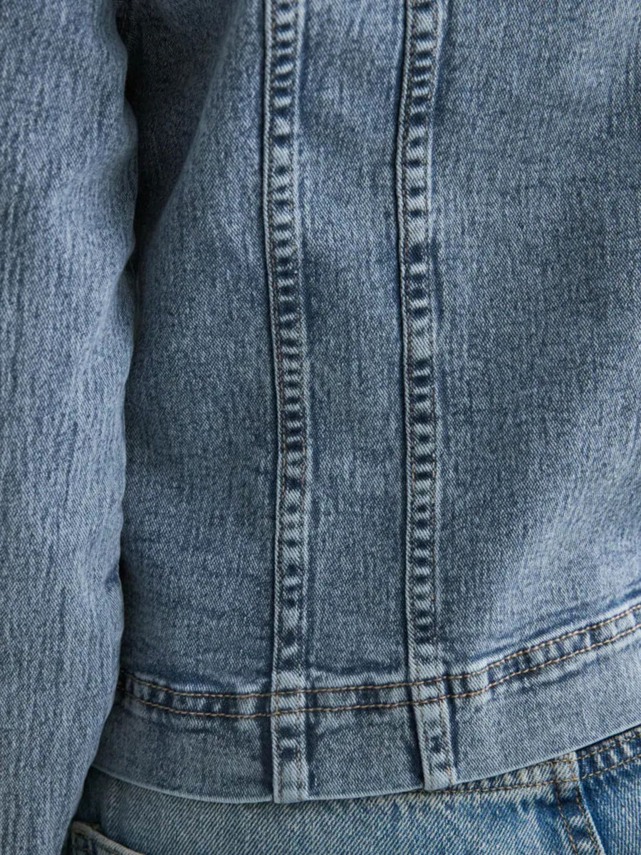 Button-down denim jacket with seam detailing and a collarless neckline.