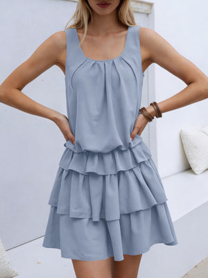 Light blue ruffled tiered mini dress with a gathered neckline and elastic waist.