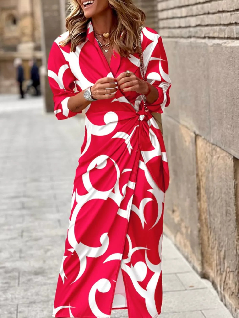 Red abstract patterned shirt dress with 3/4 sleeves and waist tie detail.