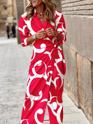 Red abstract patterned shirt dress with 3/4 sleeves and waist tie detail.