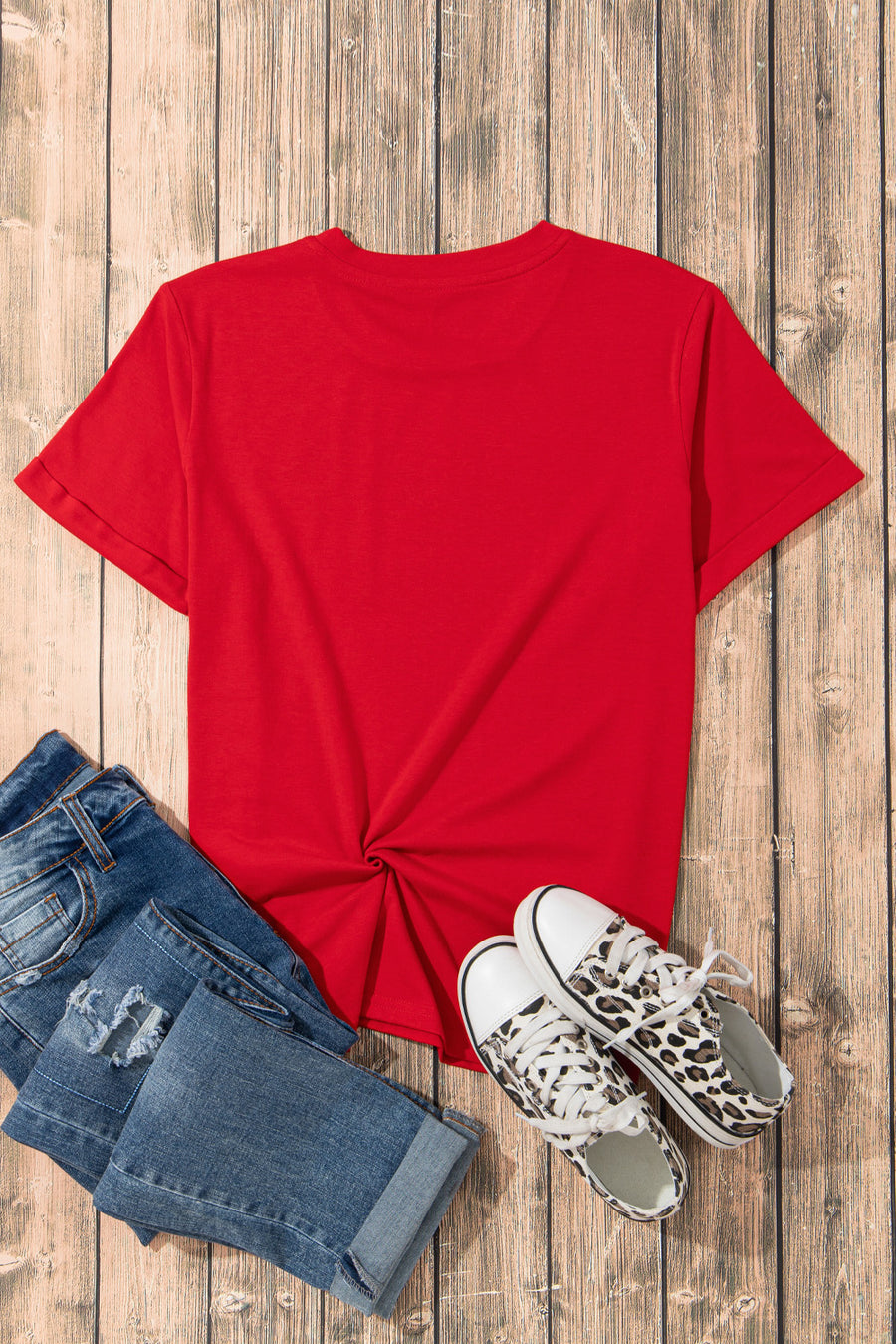 Red short sleeve t-shirt with a twisted hem detail.