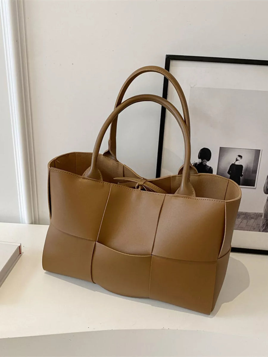 Brown woven PU leather large tote bag with double handles.