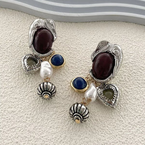 earrings in gold with dangle and long