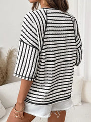100% polyester Care instructions: Machine wash cold t-shirt in Black with relaxed silhouette