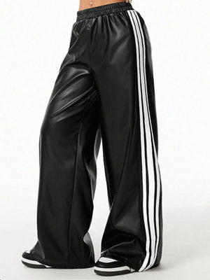 Black faux leather wide leg track pants with white side stripes and elastic waistband