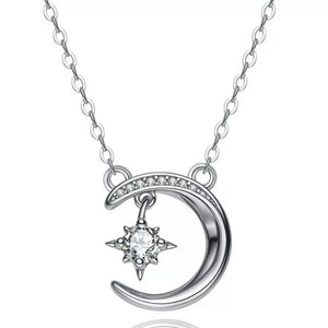 Celestial Moissanite crescent necklace with a dangling star charm, silver tone.