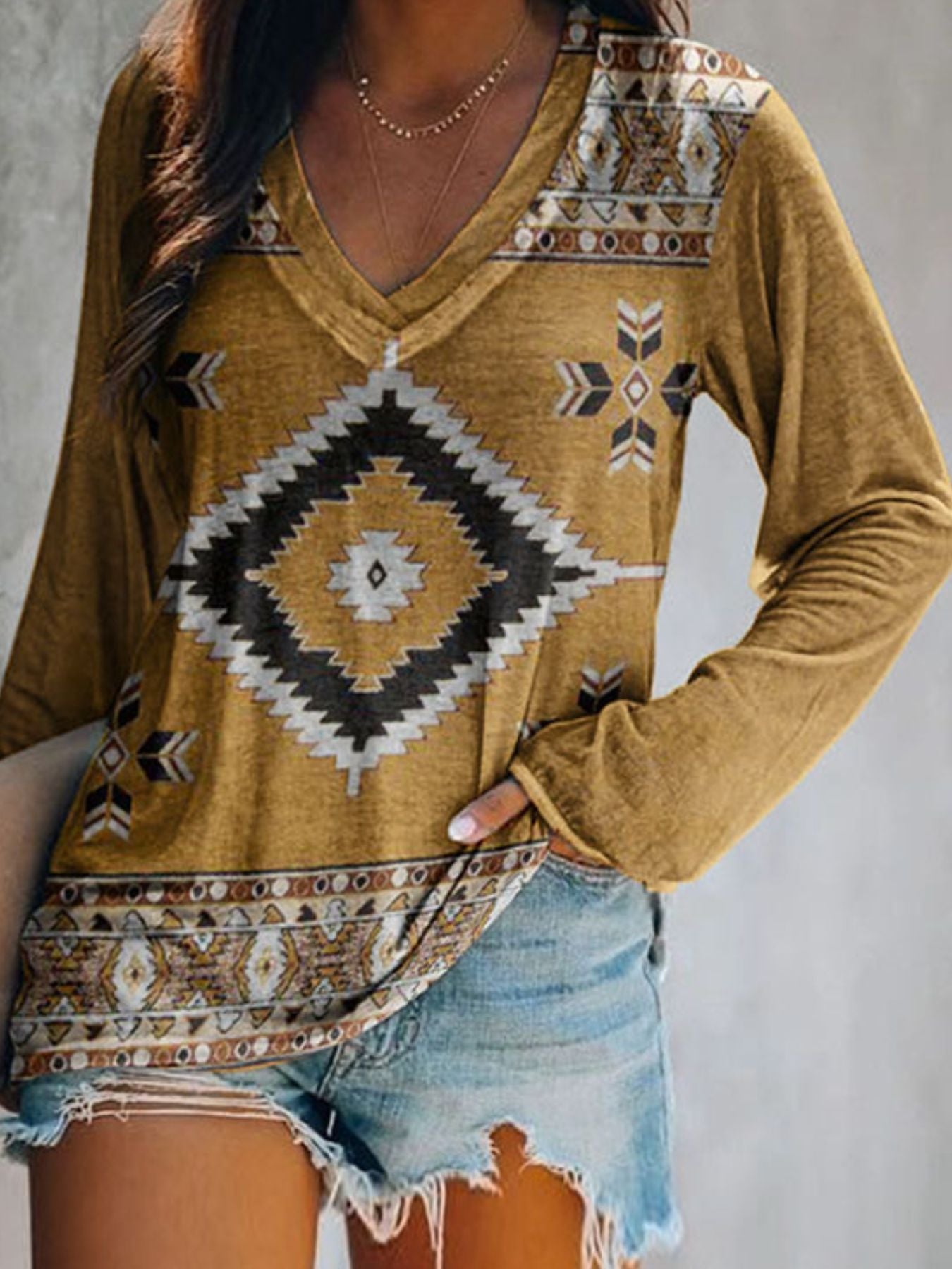 Geometric V-neck long sleeve t-shirt in coffee with tribal print and bohemian detail.