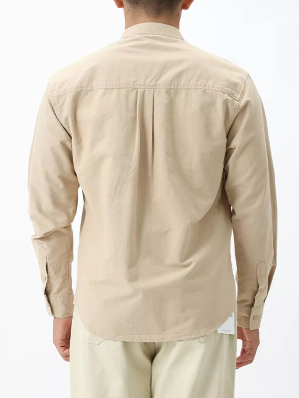 Apricot cotton casual long sleeve shirt with buttoned cuffs and back pleats.
