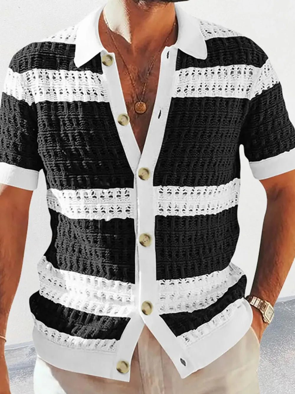 Striped crochet polo shirt with button front and collar, black and white.