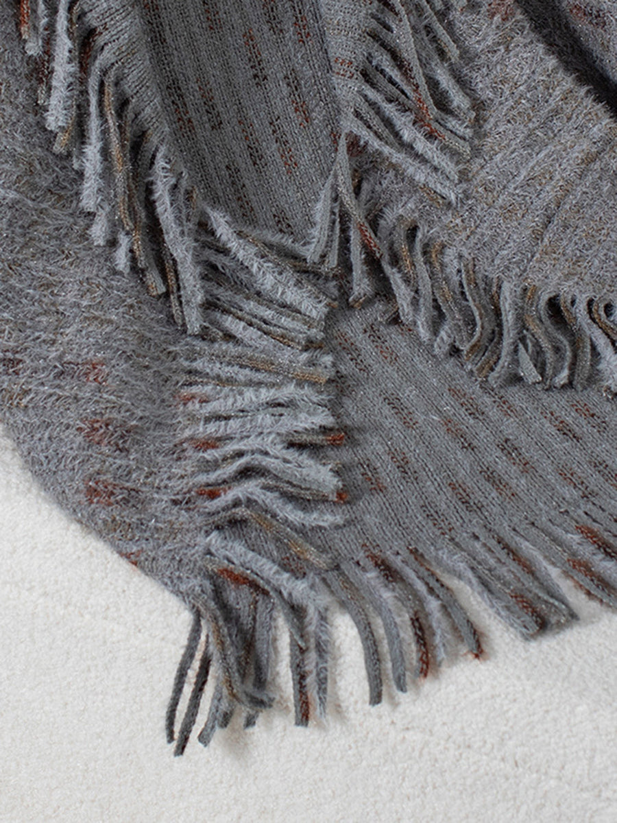 Textured fringe shawl cardigan in dark gray acrylic with subtle copper threads and fuzzy trim.