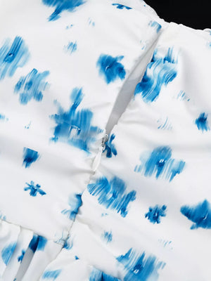 White dress with blue abstract floral print and side zipper