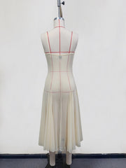 Cream sheer slip dress with spaghetti straps and pleated midi skirt