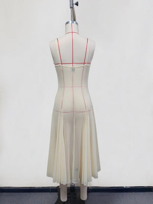 Cream sheer slip dress with spaghetti straps and pleated midi skirt