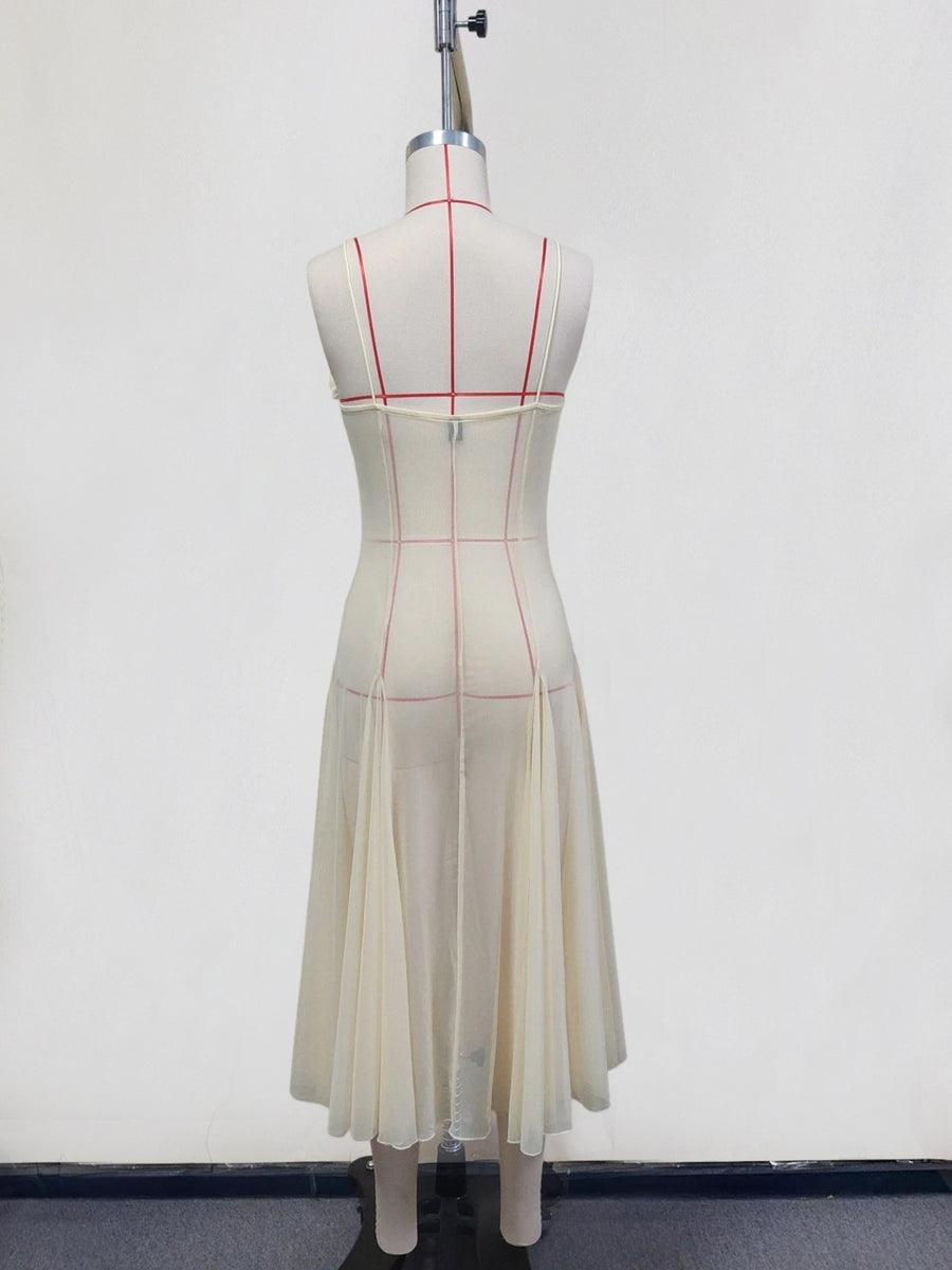 Cream sheer slip dress with spaghetti straps and pleated midi skirt