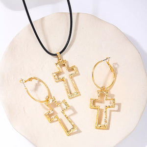 Elegant cross pendant necklace and hoop earrings set in golden 18K gold-plated metal.