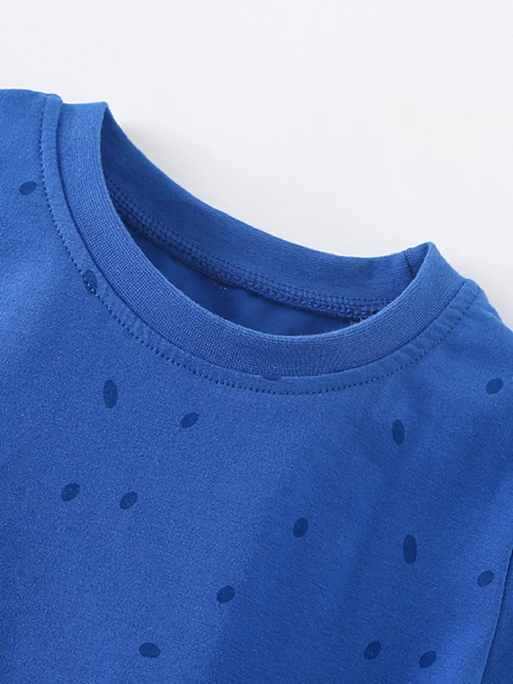 Blue cotton blend toddler t-shirt with dark blue polka dots and crew neck.