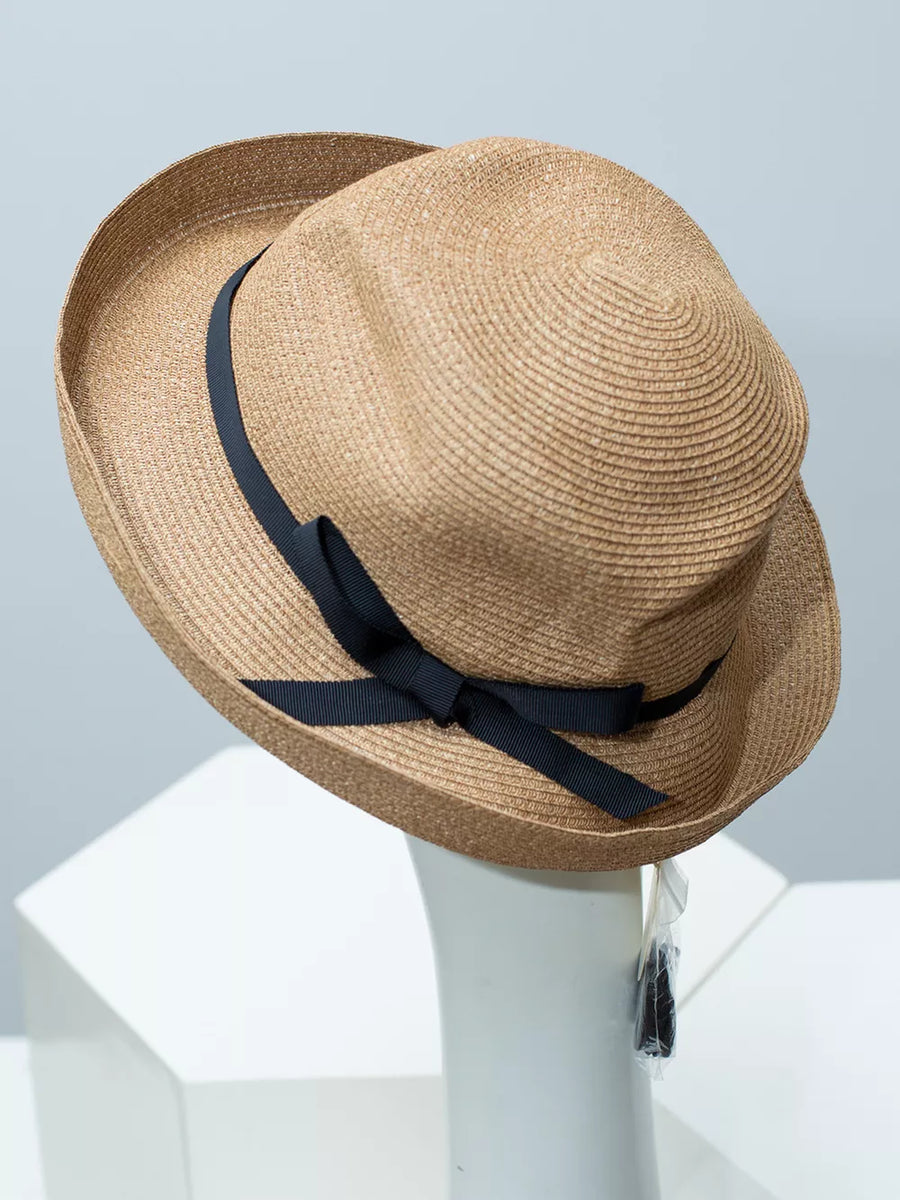 Straw sun hat in beige with a black ribbon bow detail