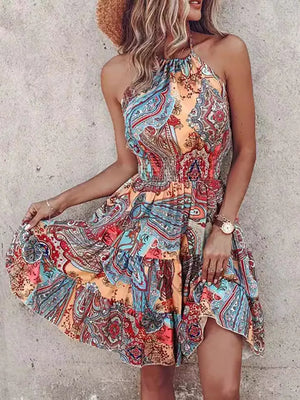 Bohemian printed halter mini dress with tiered skirt in orange and lilac.