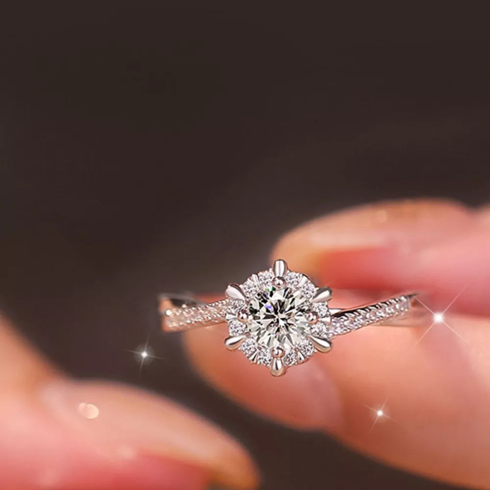 925 sterling silver,Moissanite Care instructions: Avoid wearing during exercise, ring in clear with solitaire with halo