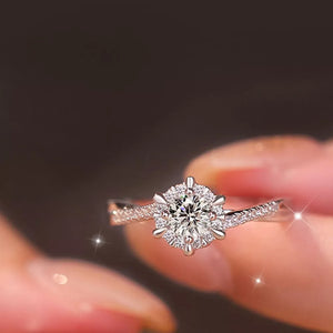 925 sterling silver,Moissanite Care instructions: Avoid wearing during exercise, ring in clear with solitaire with halo
