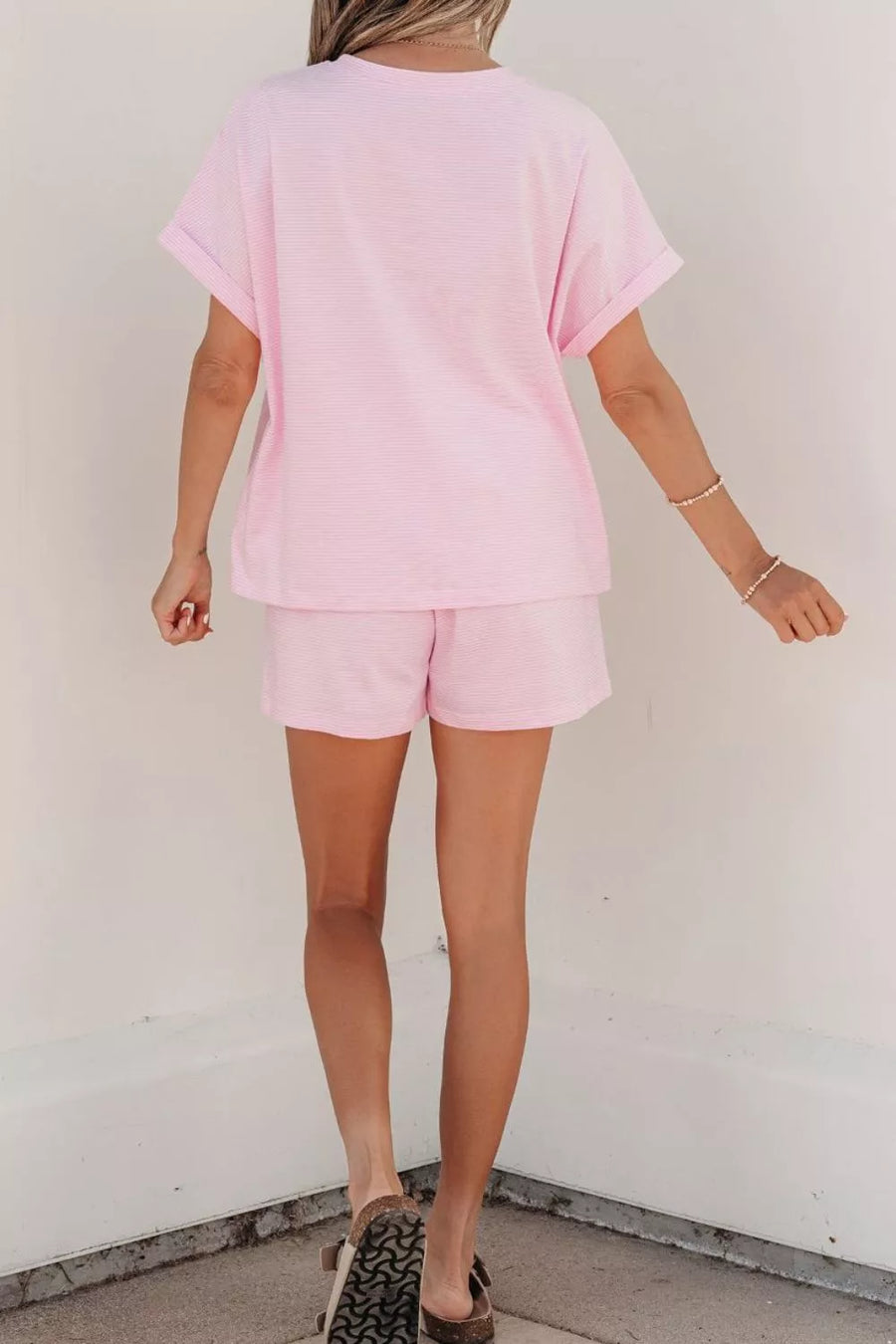 Pink striped cotton loungewear set with oversized tee and shorts.