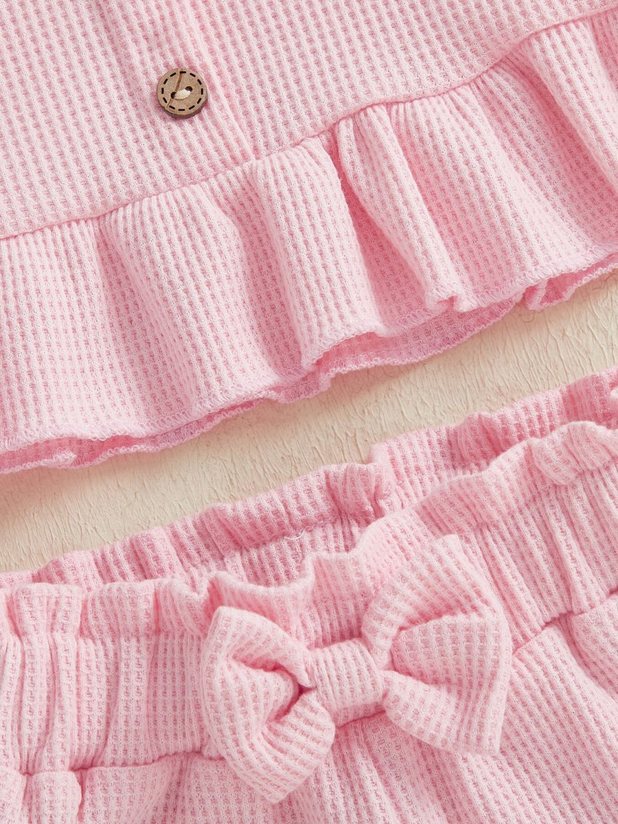 Pink waffle knit tank with ruffled hem and bow shorts set for baby girls.