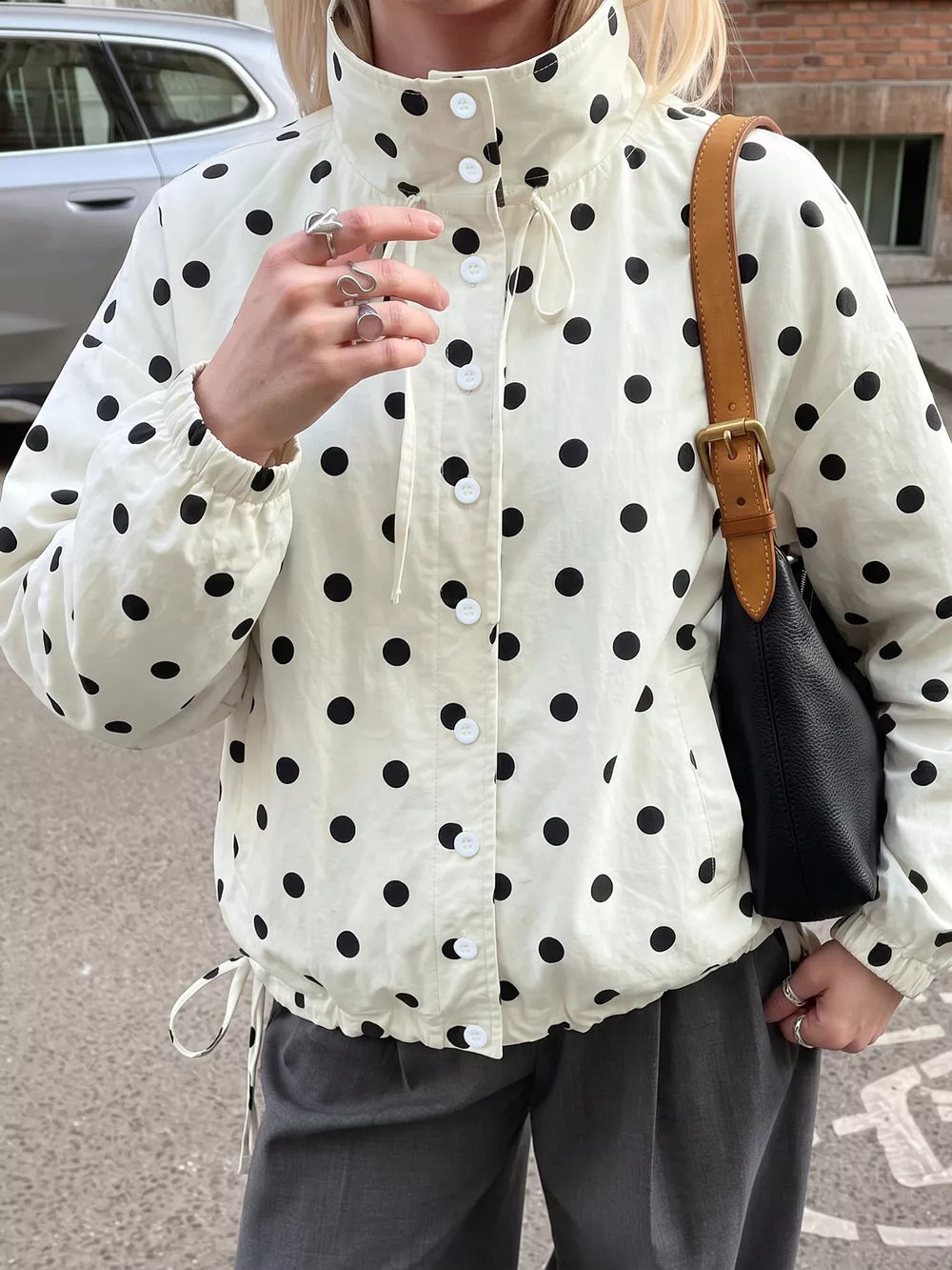 cream windbreaker with polka-dot and collared