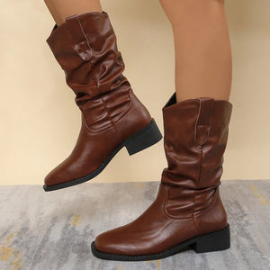 Brown slouchy western-inspired ankle boots with a low block heel.