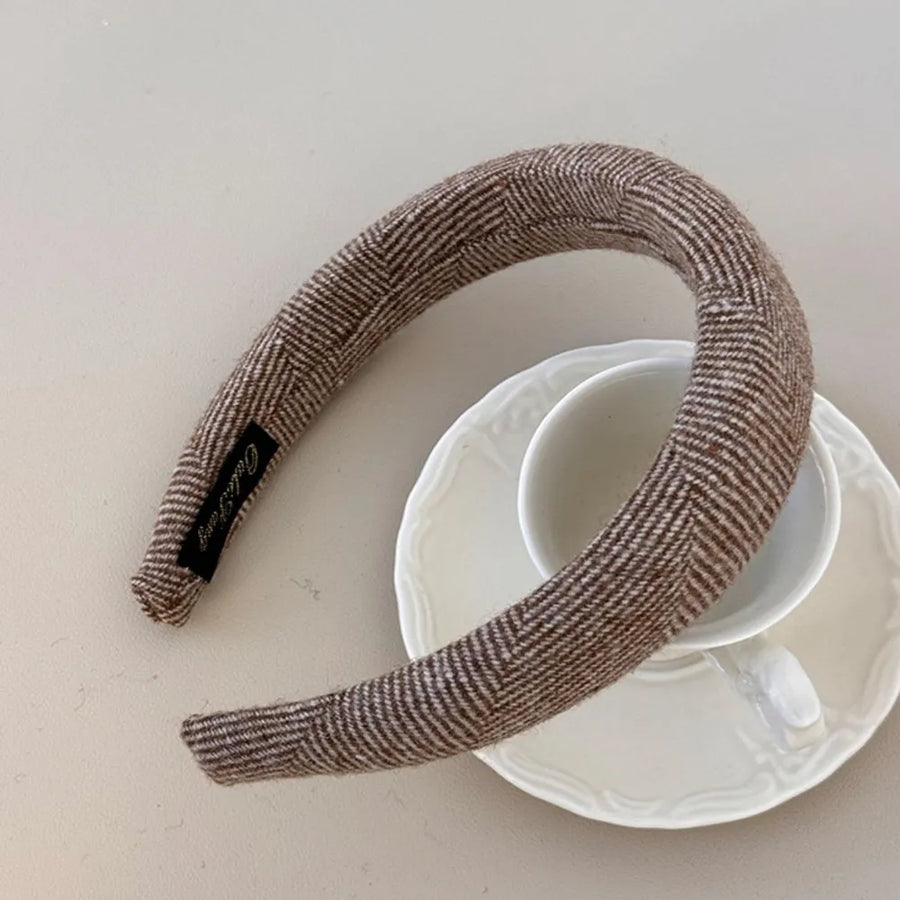 Textured tweed padded headband in coffee brown with herringbone pattern.