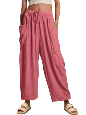 Strawberry linen balloon pants with drawstring waist and sculptural pocket detail.