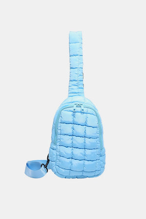 Padded sling bag in Pastel Blue with top handle and adjustable strap