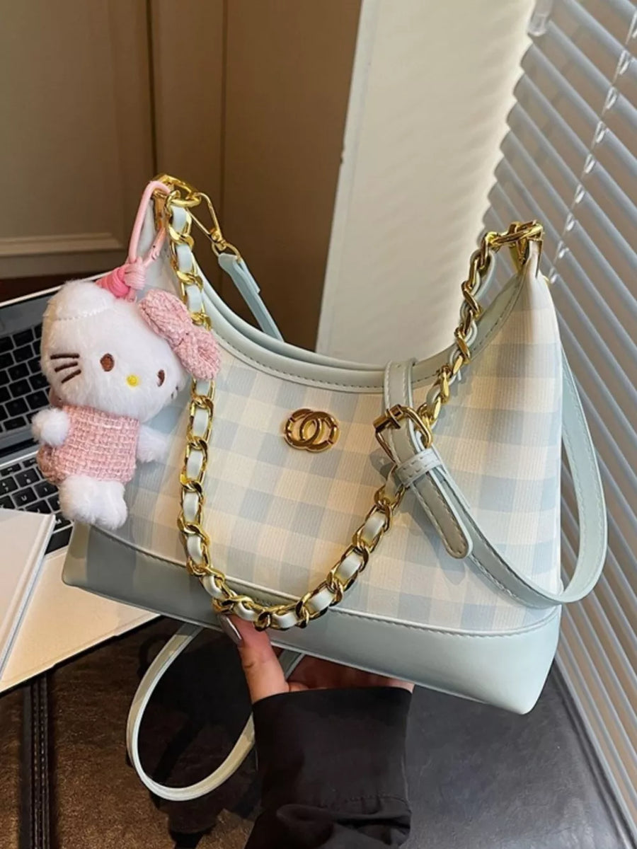Pastel blue plaid shoulder bag with gold chain accent and Hello Kitty charm