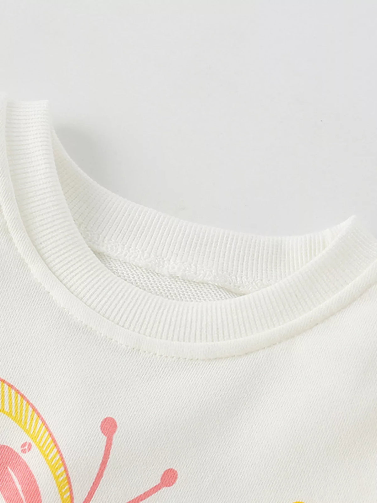 White kids' sweatshirt with a colorful butterfly graphic and ribbed crewneck.